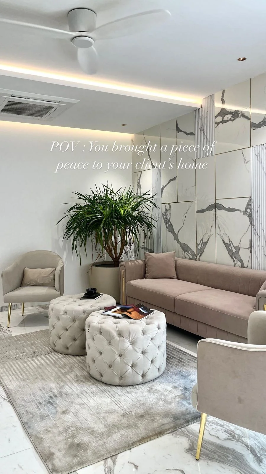 Living room with marble feature wall and layered seating