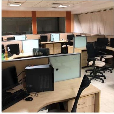 Workstation row from the completed KG360 office fit-out in Chennai