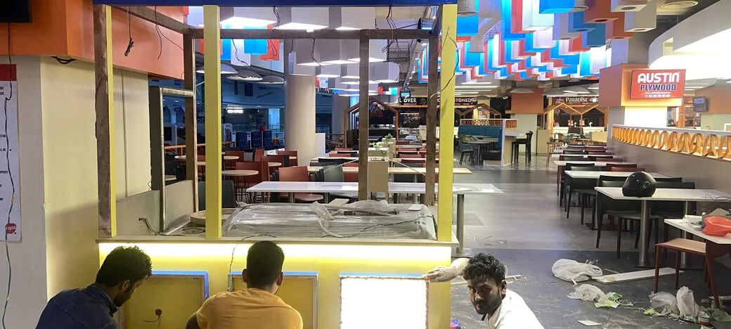 Madurai Famous Jigarthanda kiosk fit-out in Chennai by AlcorOne Solutions — Canopy structure under construction