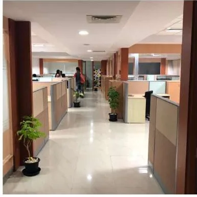KG360 office fit-out Chennai by AlcorOne Solutions — corridor and workstation hallway