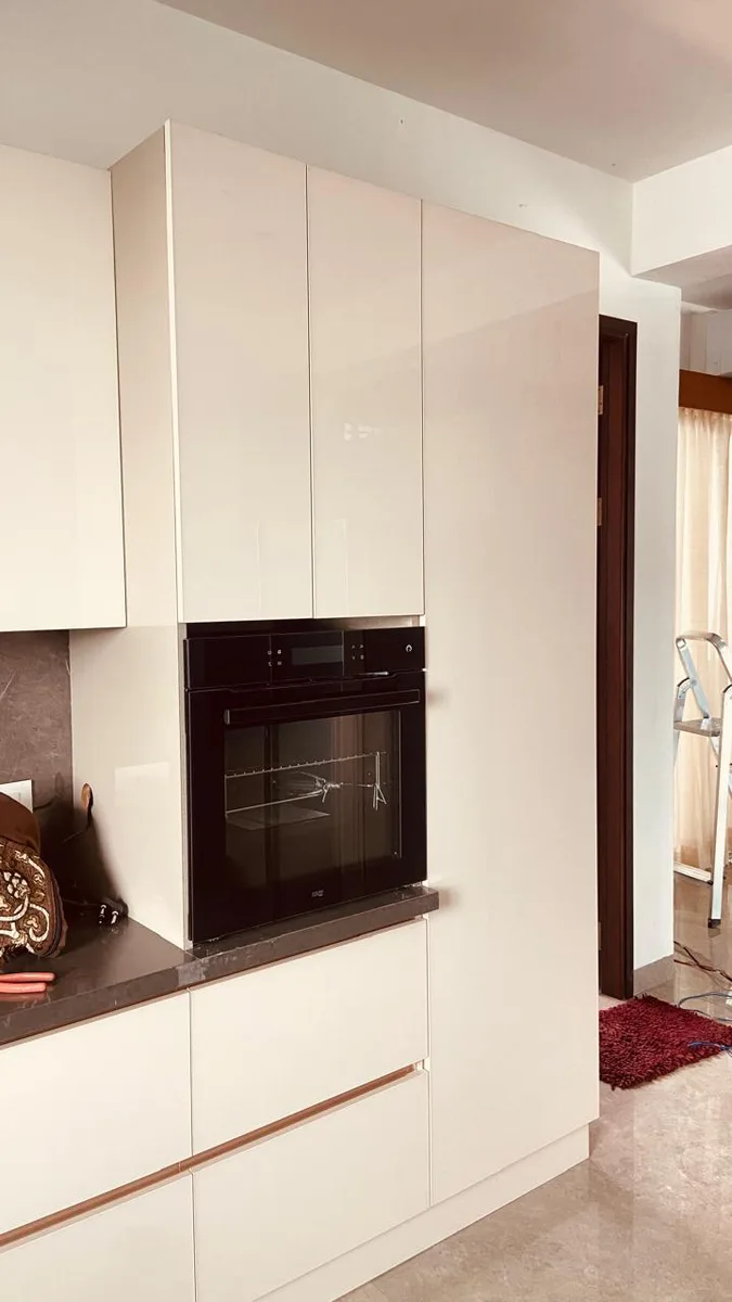 EIPL La Paloma duplex interior in Hyderabad by AlcorOne Solutions — Kitchen tall units &amp; oven