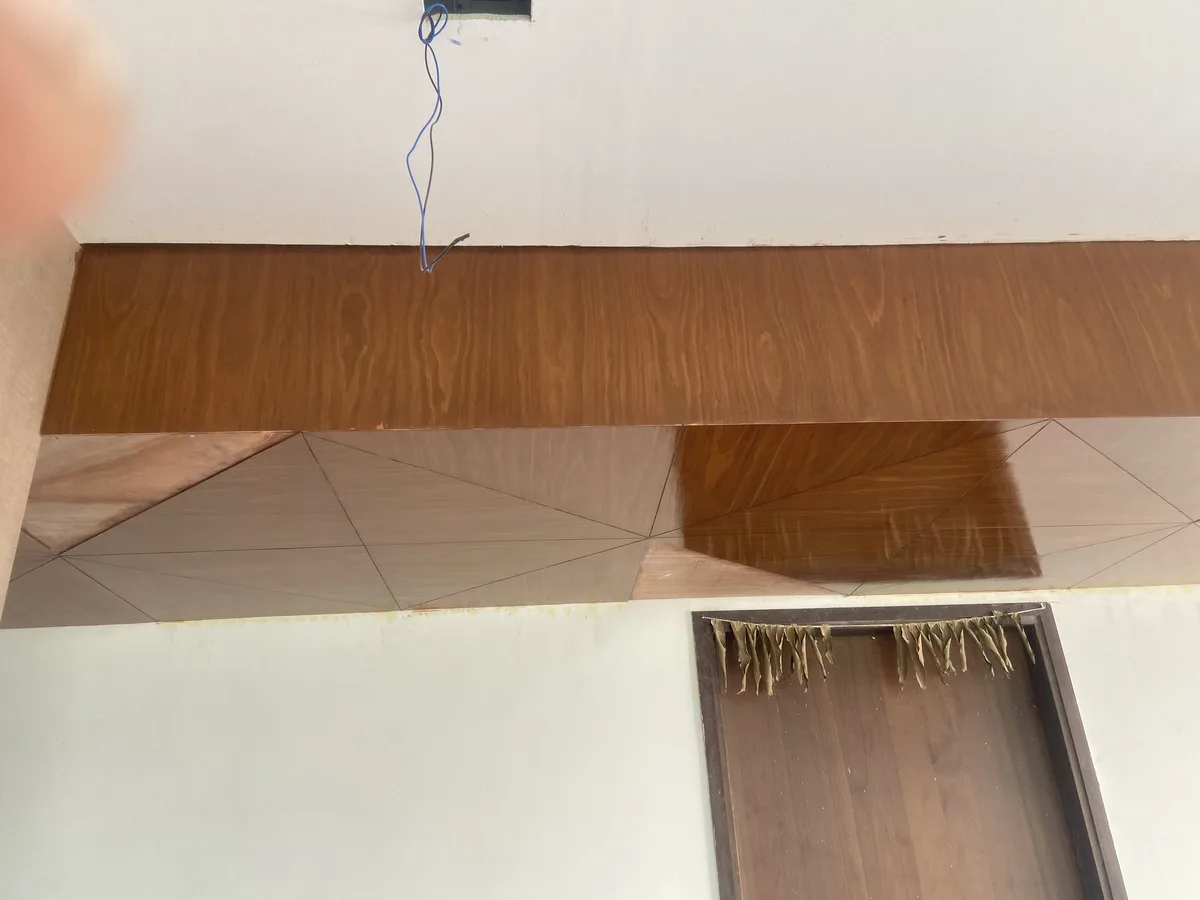 Villa interior in Hyderabad by AlcorOne Solutions — Veneer feature wall