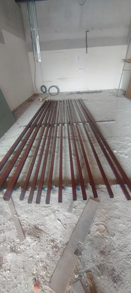 Steel fabrication rods cut and laid out on the mall floor