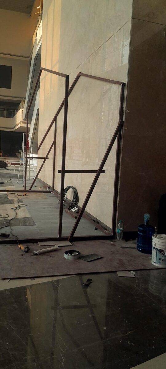 Frame section and cable coil on the polished mall floor